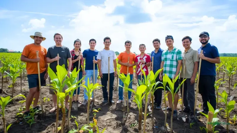 A local community celebrates a tree planting project, illustrating the social impact of non-profit tree planting websites like Eden.